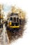 Old-fashioned tram moving along Lisbon street