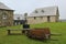 An old-fashioned wheelbarrow and a cooking enclosure at historic fortress of Louisbough