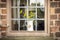 Old fashioned window with jug of yellow flowers