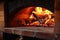 an old-fashioned wood-fired oven with vivid flames