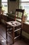 Old fashioned wooden chair in sunlights, Dutch interior and room decoration in rich fisherman`s house in North-Holland, Enkhuizen