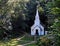 Old fashioned wooden country church in the forest