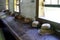 Old fashioned wooden school desk with straw hats