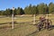 Old field cultivator by a corral fence in the Black Hills area