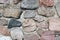 Old fieldstone wall of field rocks. full frame background