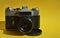 an old film camera, a lens. antique equipment. background for the design