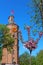 Old fire tower with clock (1911) and sakura tree, Vinnytsia, Ukraine