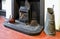 Old fireplace, grate, coal scuttle and enamel kettle in an old h