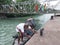 An old fisher man  anchoring his boat with jetty
