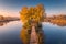 Old fisherman house and wooden pier at sunrise in autumn