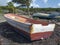 Old fishermen boats stranded on the Caribbean coast in a natural tropical environment. Old wrecked boat, stranded on the beach