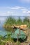 Old fishing boat in a calm water lake during daylight in La Alb