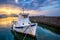 Old fishing boat in port of Naousa on sunset. Paros lsland, Greece