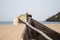 Old fishing boat standing on the sandy beach. India, Goa