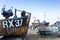 Old Fishing boats and equipment on Hastings beach landscape at d