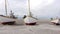 Old Fishing Boats Lined Up Ashore on Thorup Strand Beach in Denmark