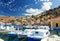 Old fishing Boats at Simi island, background of beautiful multi-colored buildings in island