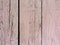 old flaked peeled weathered light red maroon brown paint wood curve board planks background