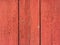 old flaked peeled weathered red maroon brown paint wood planks background texture