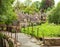 Old footbridge and traditional Cotswold cottages, Bibury, England, UK