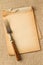 Old fork and yellowed notebook