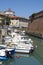 The old fortress Fortezza Nuova with channel,boats and houses in Livorno,Italy