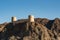 Old fortress on top of the rocky mountain in Muscat