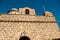 The old fortress wall and the bell. Fortification of Castillo de Jagua castle. Old fortress in Cuba. Cienfuegos.