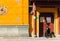 An old fortune teller sitting at entrance gate of Sanguan Temple