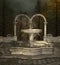 Old fountain in a misty woodland