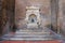 Old fountain with small boy on a dolphin on Cavour square in Rim