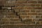 Old, frayed yellow brick wall texture, background