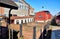 Old freight train with wooden wagons at a freight yard. Diesel locomotive in the old depot