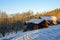 Old frosty barns in a slope