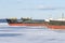 Old frozen cargo ships in the port on Onega lake in winter