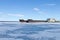 Old frozen cargo ships in the port at winter time