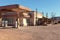 Old gas station in Sahara desert near Ouarzazate, Morocco. Toned image