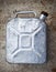 Old gasoline jerry can above concrete background