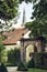 Old gate, red roofs and tower of church in Schwabach city, Germa