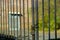 The old gates of the factory are locked with a rusty old chain around them