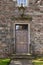 Old Georgian stone townhouse door with fanlight window above door