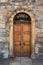 Old Georgian stone townhouse door with fanlight window above door