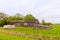 Old German brick farmhouse with a caravan in the garden