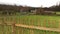 Old German Houses in Field and Wooden Fence