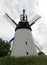 Old German Windmill with Cloudy Sky