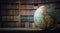 Old globe on bookshelf background. Selective focus. Retro style.