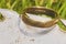 Old gold wedding ring exposed on shovel,found in life dig by metal detector.