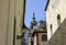 Old gothic architecture house historical landmark Prague Czech republic city Europe tour blue sky windows loopholes background