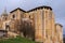 Old gothic style catholic church back view with a dramatic sky in palencia, spain