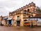 An old grand mansion with weathered walls on the streets of the town of Karaikudi in
